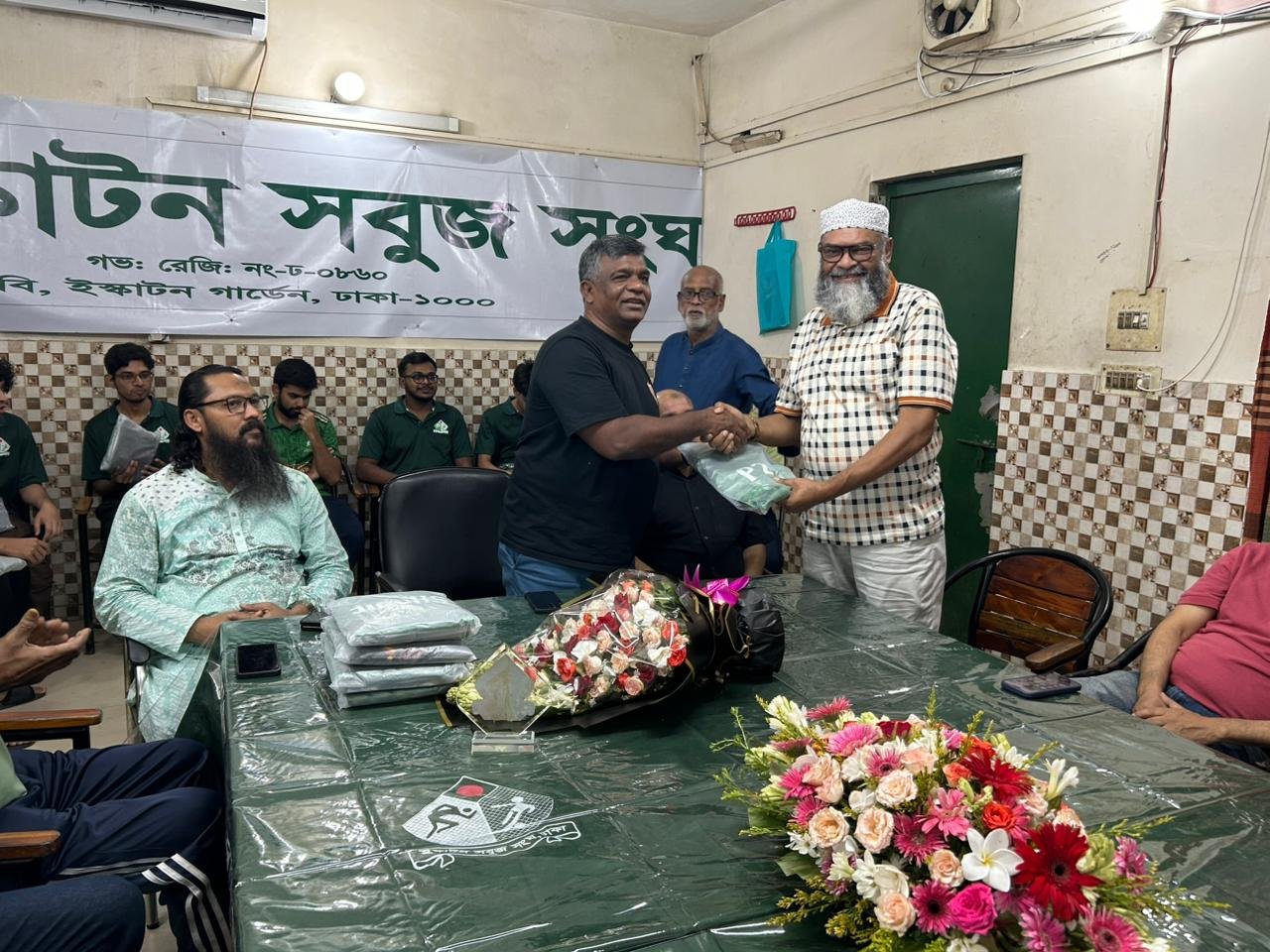 Mohammed Monirul Islam receiving souvenir from Mr. Aminul Islam